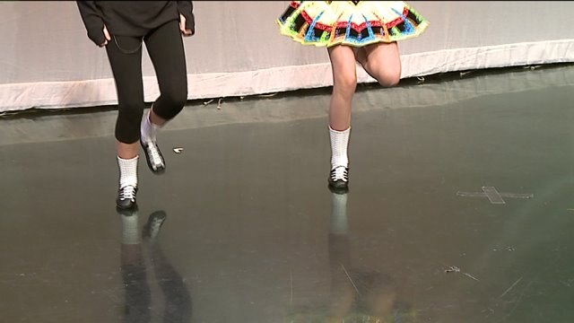 The Trinity Irish Dancers teach the hosts some moves