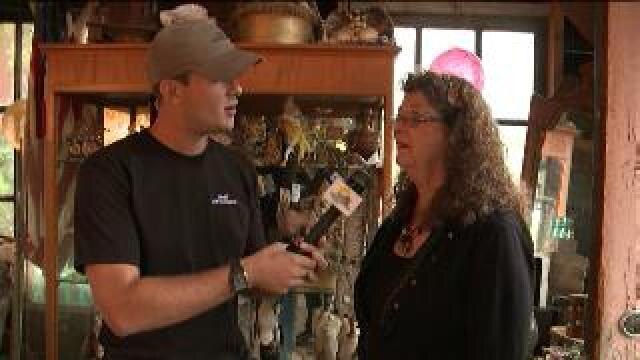 Chip talks with Hippie Tom's wife, checks out sale items