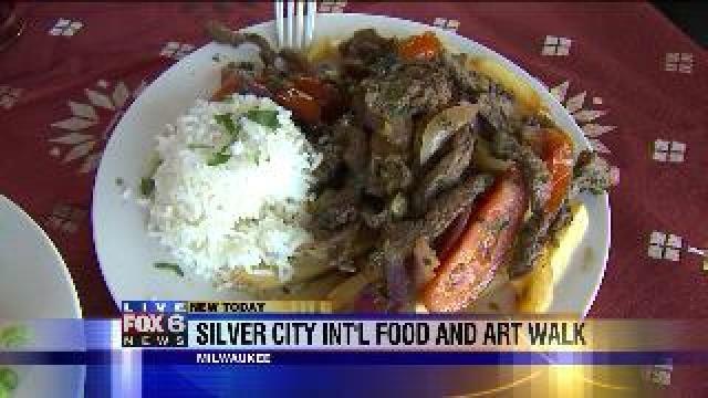 Laura checks out food at Silver City International Food and Art Walk