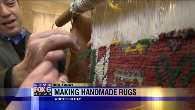 Laura helps make rug after wool is put on loom
