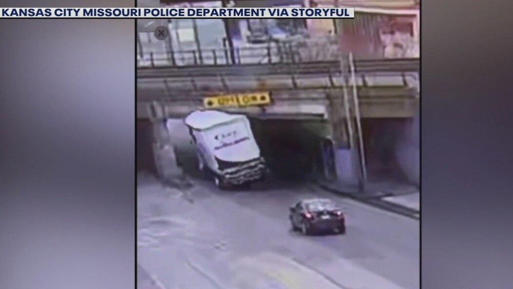 Semi truck left 'topless' after run-in with bridge