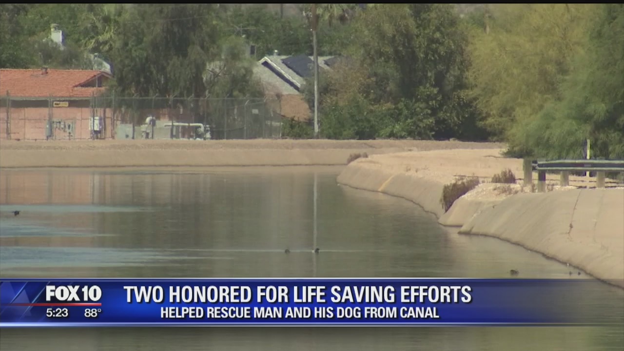 Two honored for saving man and dog from canal