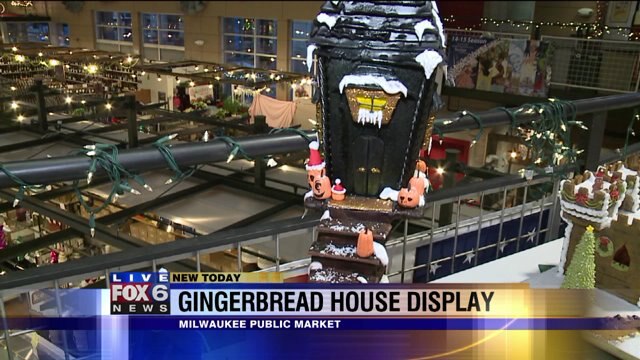 Justin checks out gingerbread house display at Milwaukee Public Market