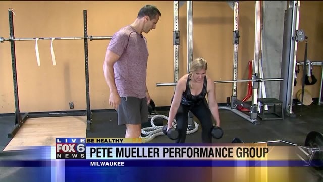 Laura engages her core and major leg muscle groups with deadlifts