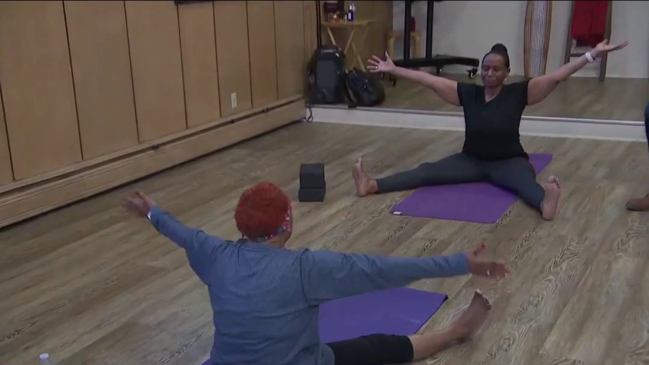 Doing yoga inside the studio