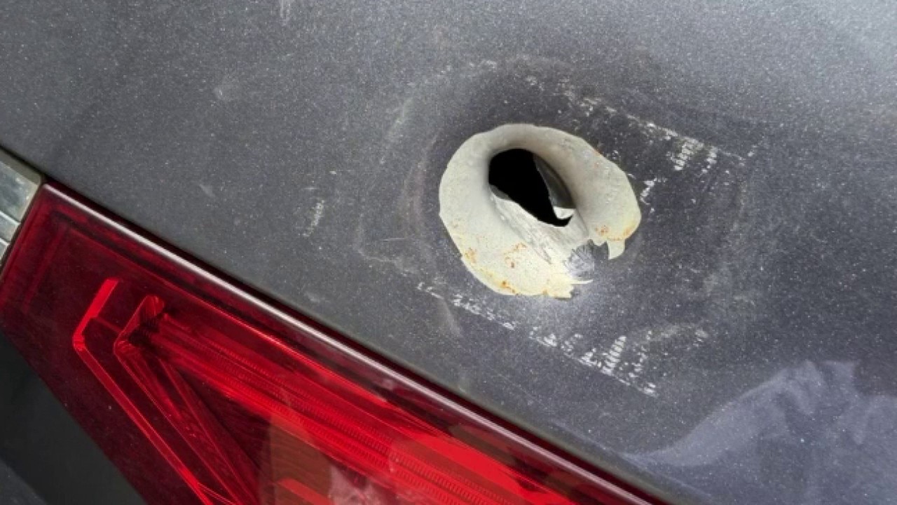 Stray bullet strikes minivan near busy commercial hub