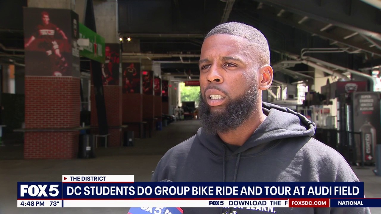 DC students bikes do group bike ride and tour at Audi Field