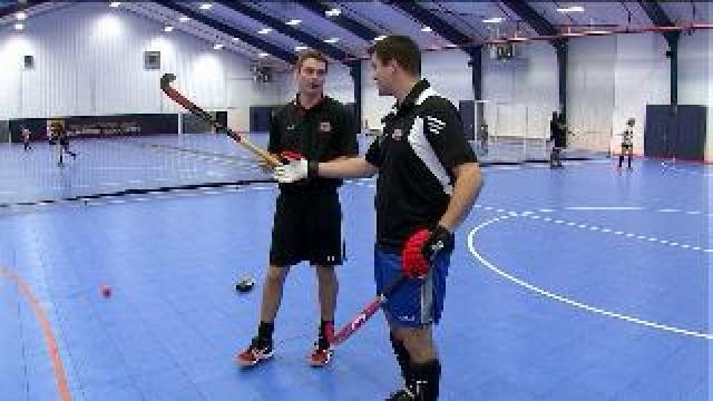 Chip learns how ot play field hockey