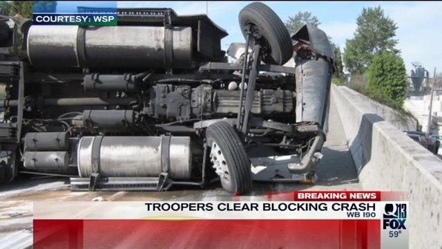 Overturned semi creates backups on I-90
