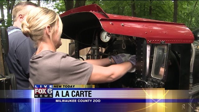 Laura learns how to operate the train at the zoo