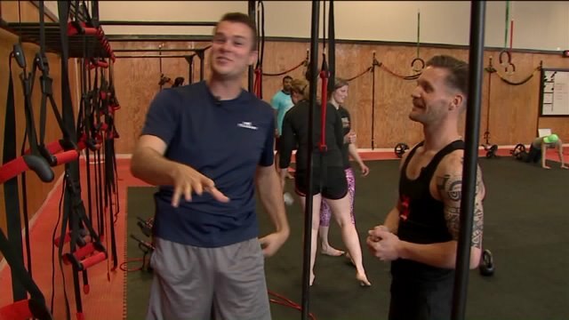 Chip works on upper body strength at Monkey Bar Gym