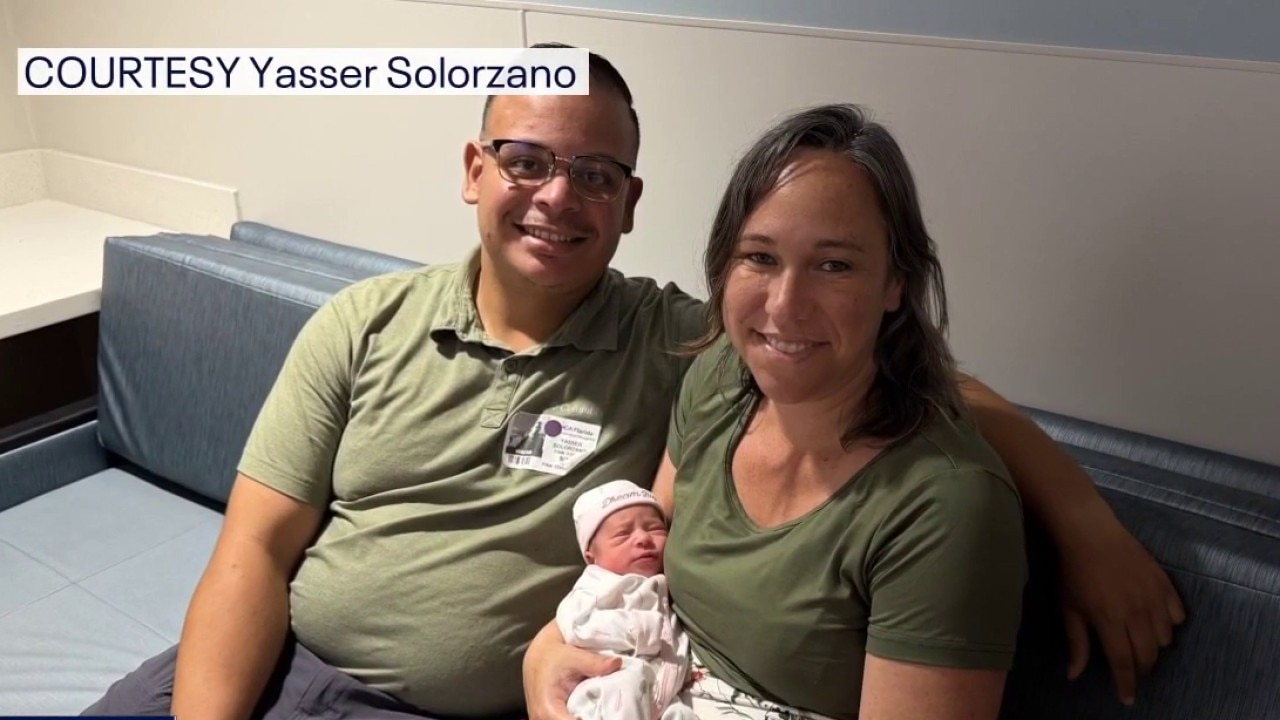 Dad delivers baby in parking lot