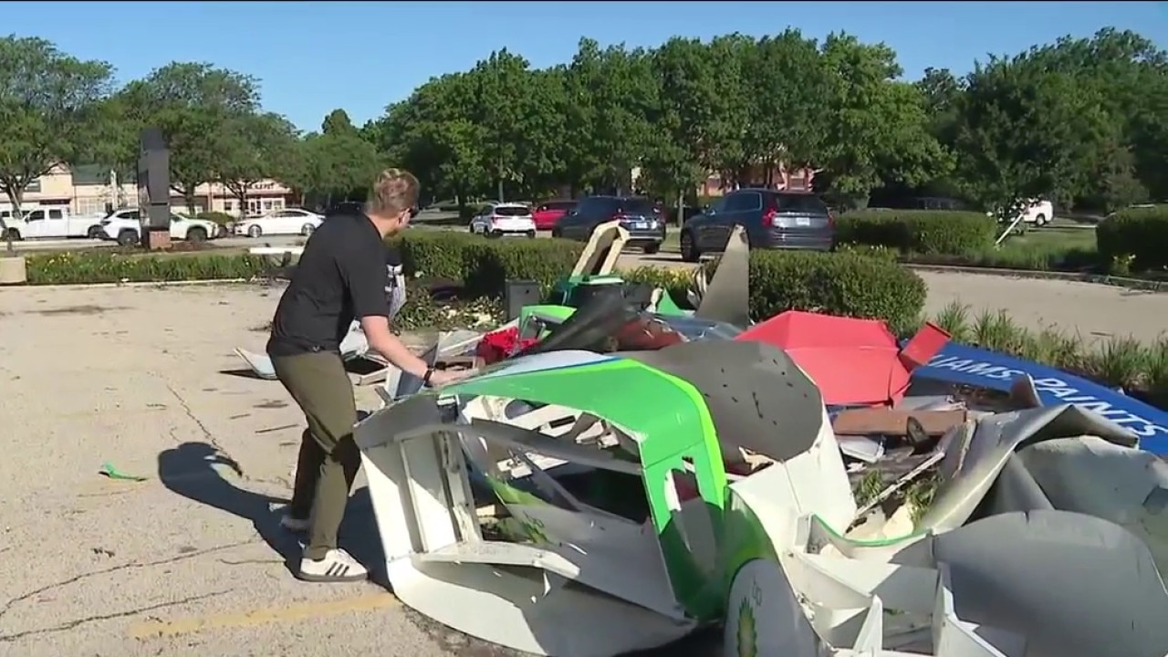Suburban gas station debris carried away by powerful winds during Illinois tornado outbreak