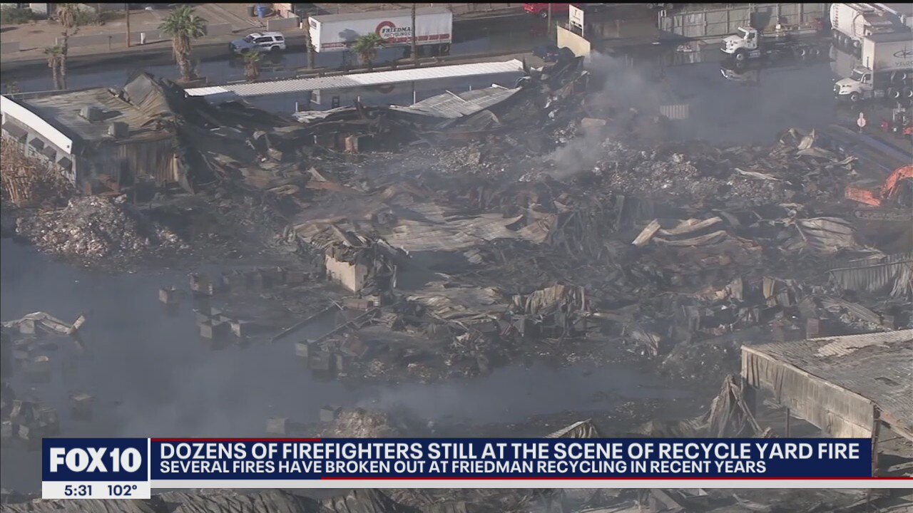 Dozens of Phoenix firefighters remain at site of massive recycling yard fire