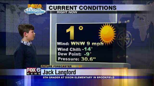 Jack helps FOX6 Meteorologist Rob Haswell with the weather