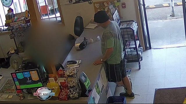 WANTED: Spider shirt-wearing armed robber
