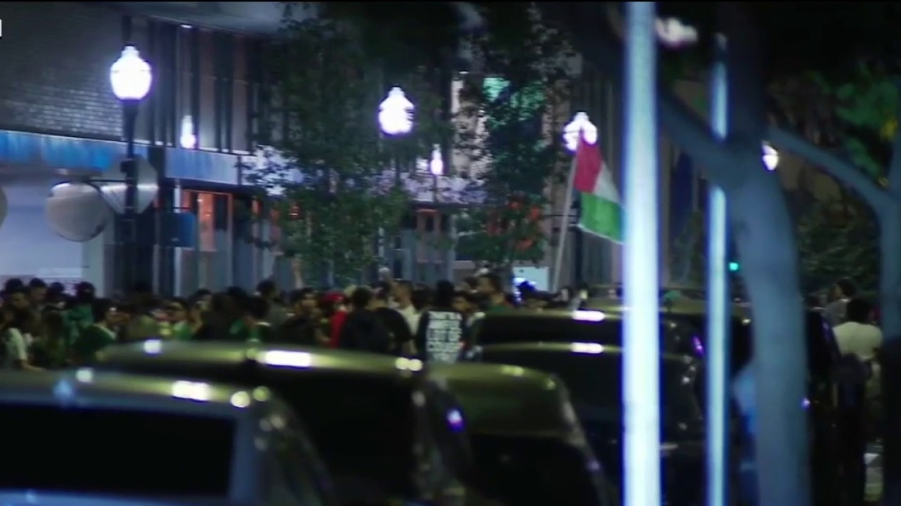 Fans celebrate Mexico's win at San Pedro Square in San Jose