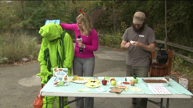 Laura learns about Halloween activities at Cider Sunday