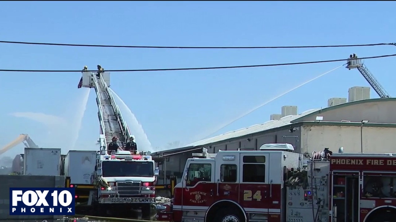 Crews battle scrapyard amid hot weather
