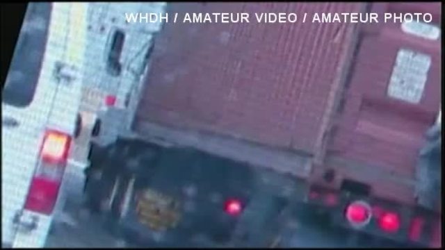Teens are seen clinging to a truck on a Massachusetts highway