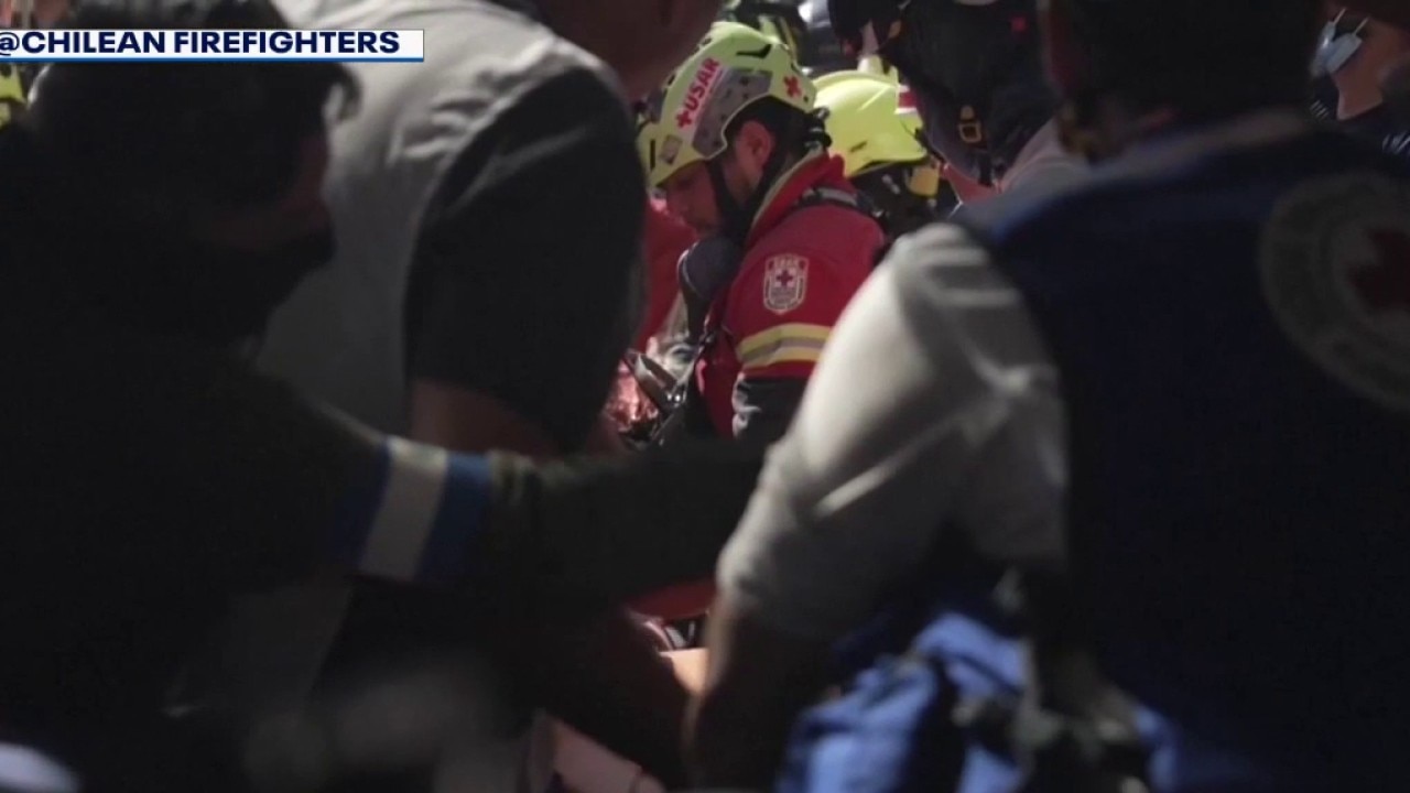 Man pulled alive from 30-ft hole in Venezuela