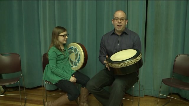 Brian learns how to play a Bodhran