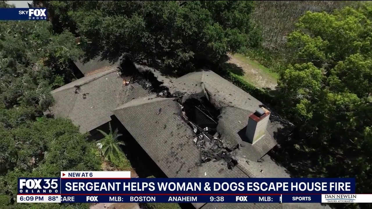Leesburg police sergeant helps woman, dog escape house fire