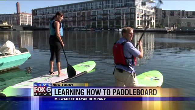 Carl has a blast learning how to paddleboard