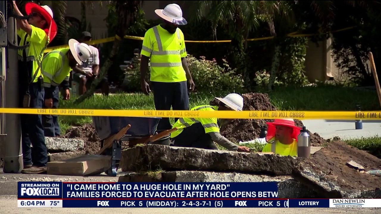10-foot hole opens in Orange County front yard after storms