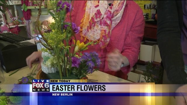 Laura helps make a floral arrangement