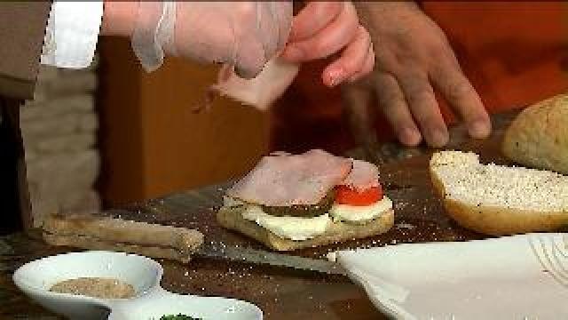 Chef Feker prepares grilled cheese and roasted veggie panini