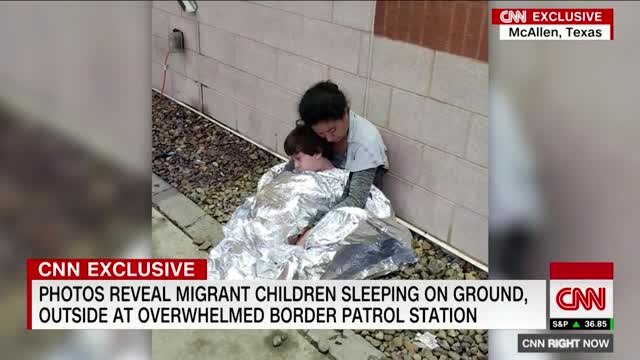 Photos reveal migrant children sleeping on the ground