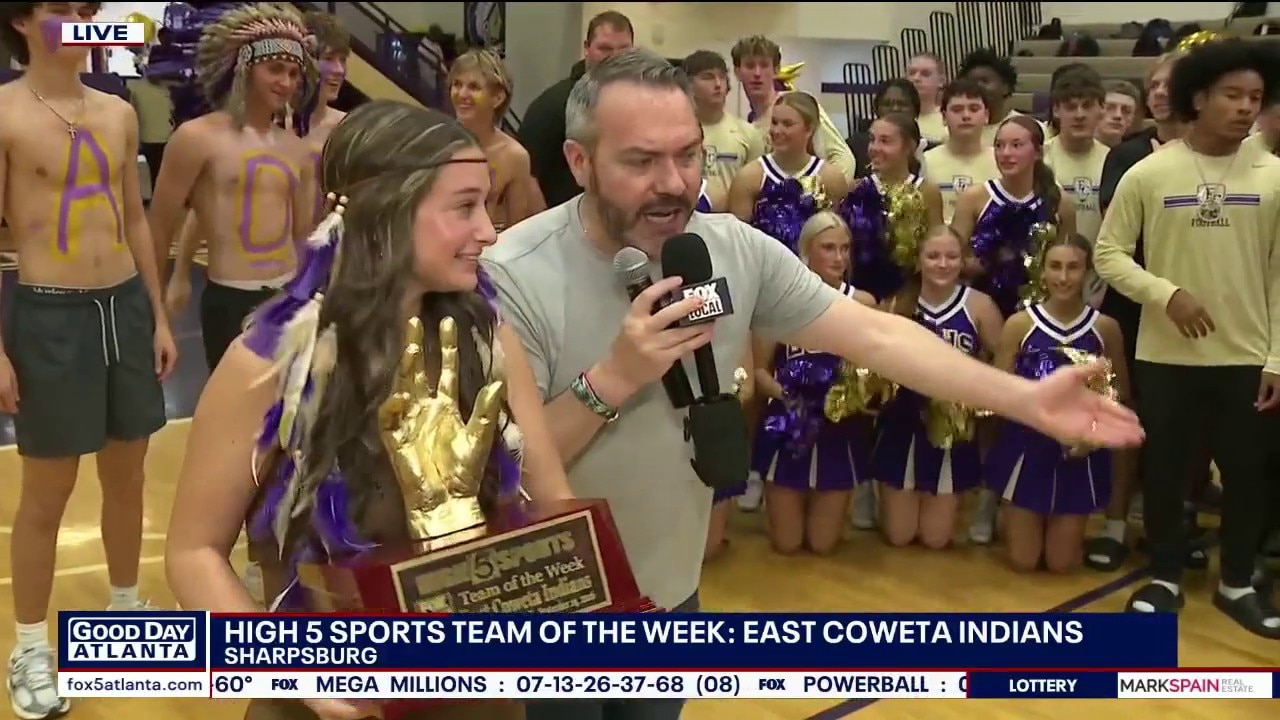 East Coweta Indians celebrate with trophy