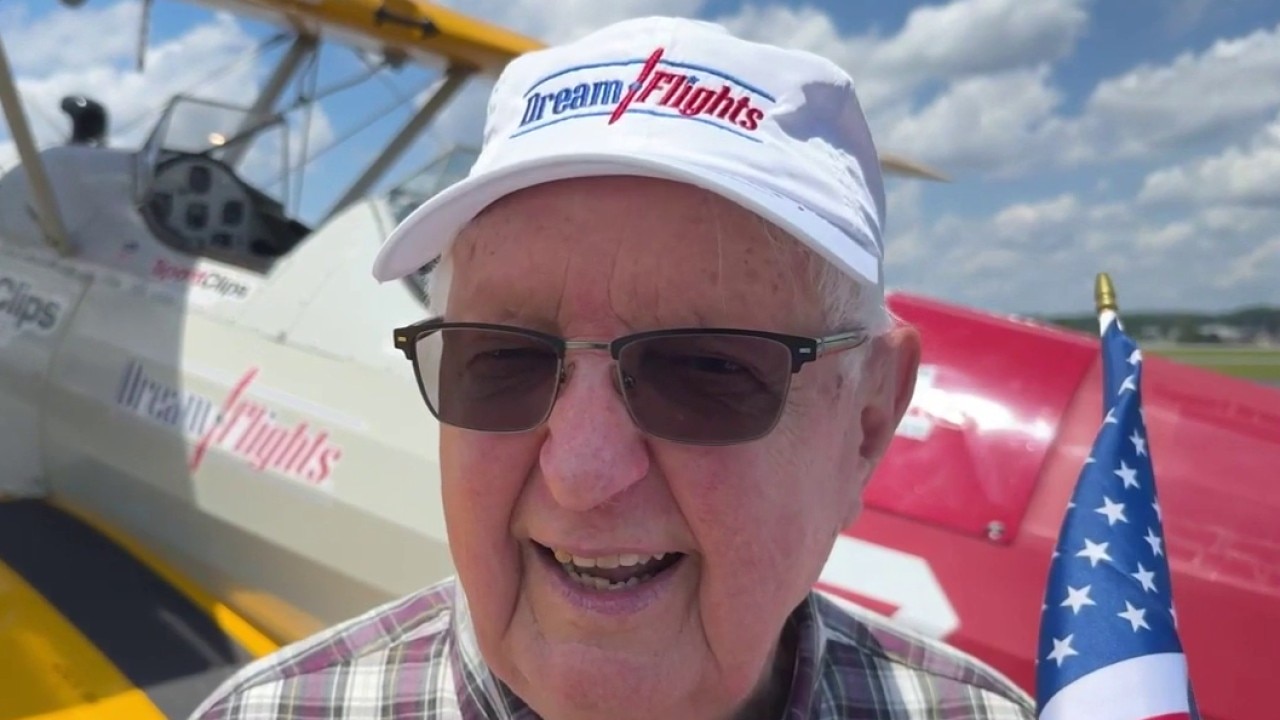 Veterans soar over Lawrenceville in restored WWII biplane