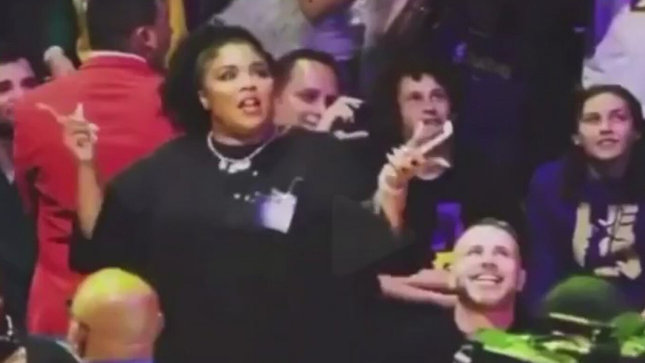 Lizzo under fire for baring backside at basketball game