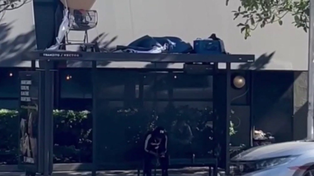 Homeless encampment spotted on top of bus stop