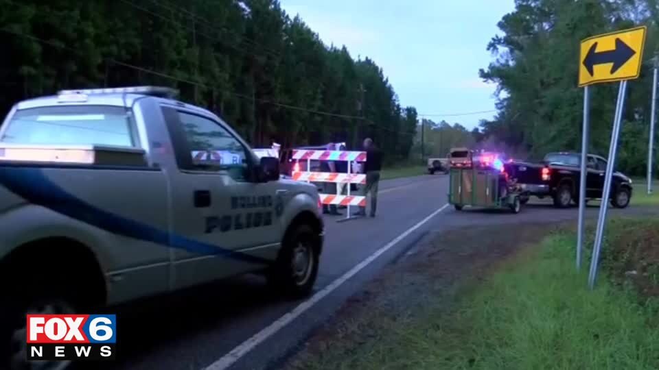 2 dead afte van swept away