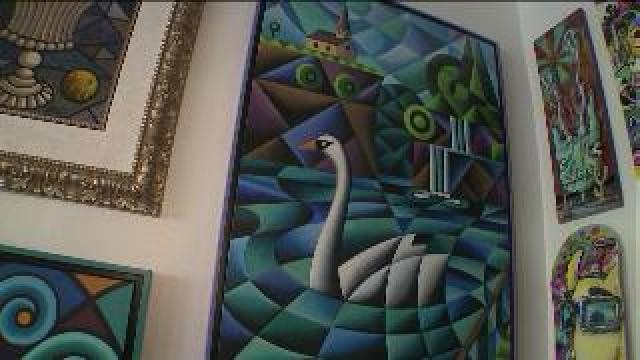 Tony checks out art at The Pink Llama Gallery
