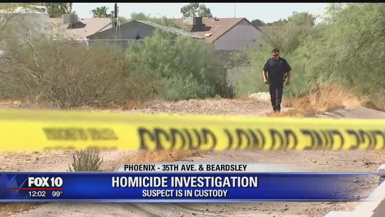 Police: 1 in custody after body found in Phoenix wash