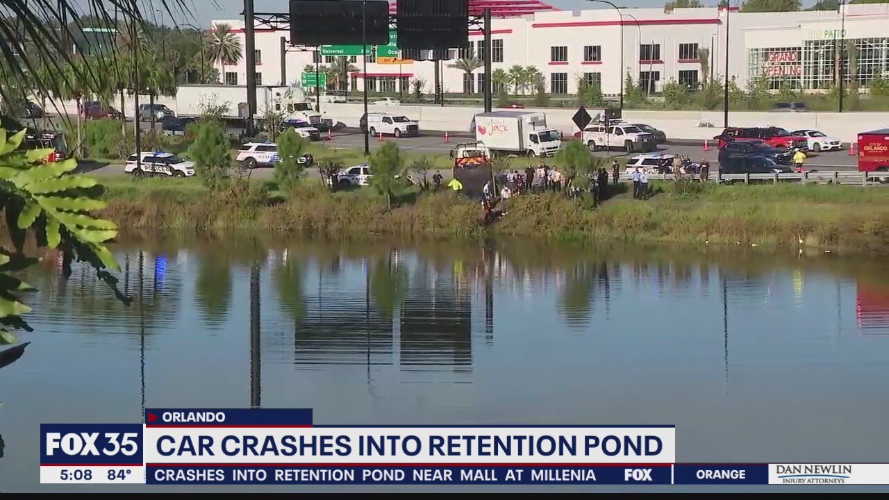 Car crashes in retention pond