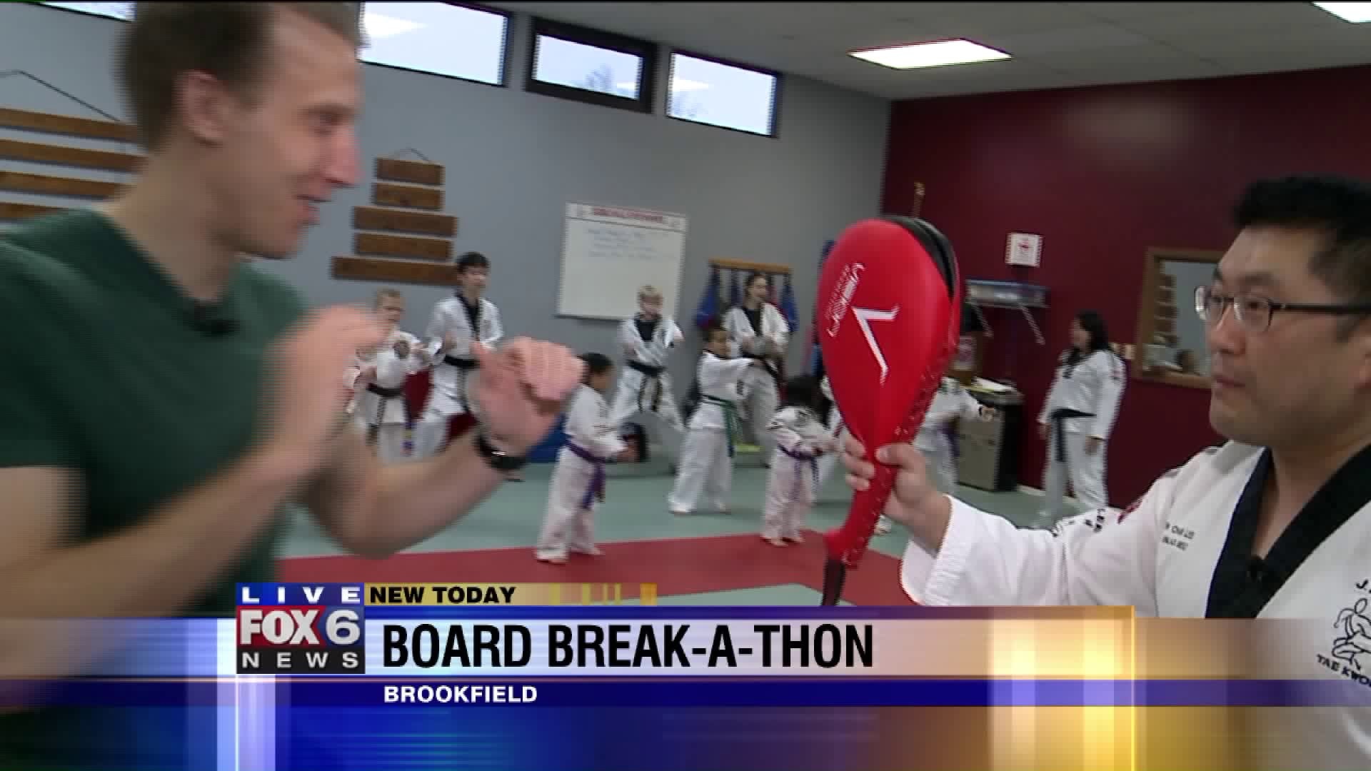 For two decades, a local martial arts school has fought cancer one broken board at a time