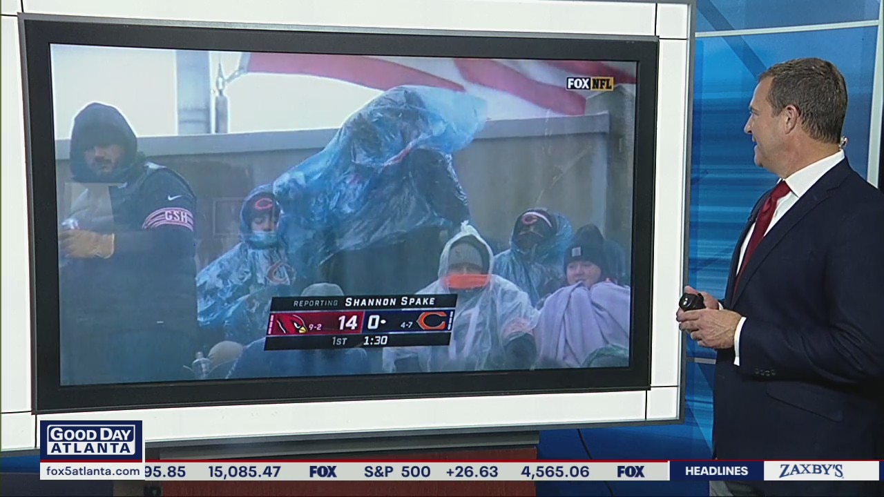 You Gotta See This: Football fan struggles to put on poncho during downpour