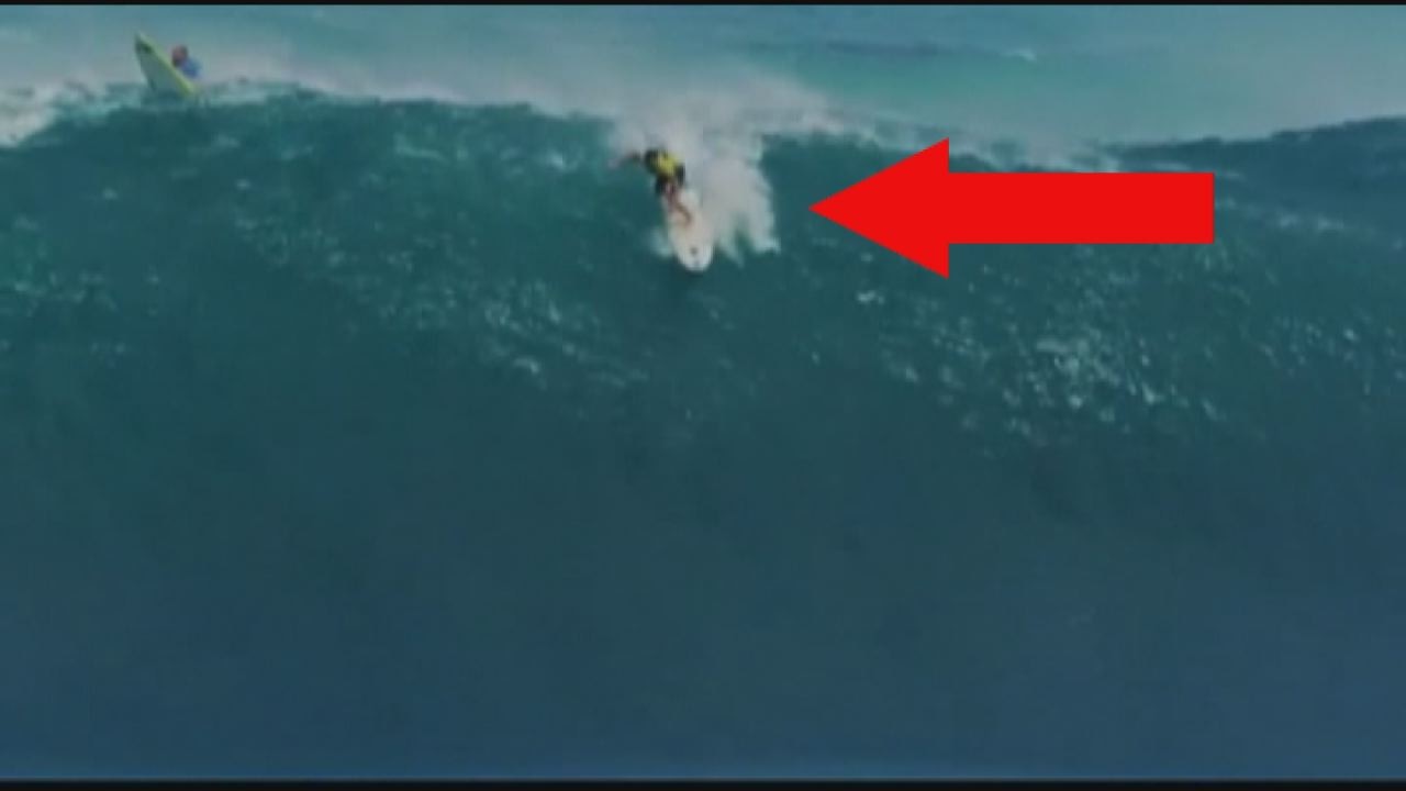 Surfers tumble on giant waves