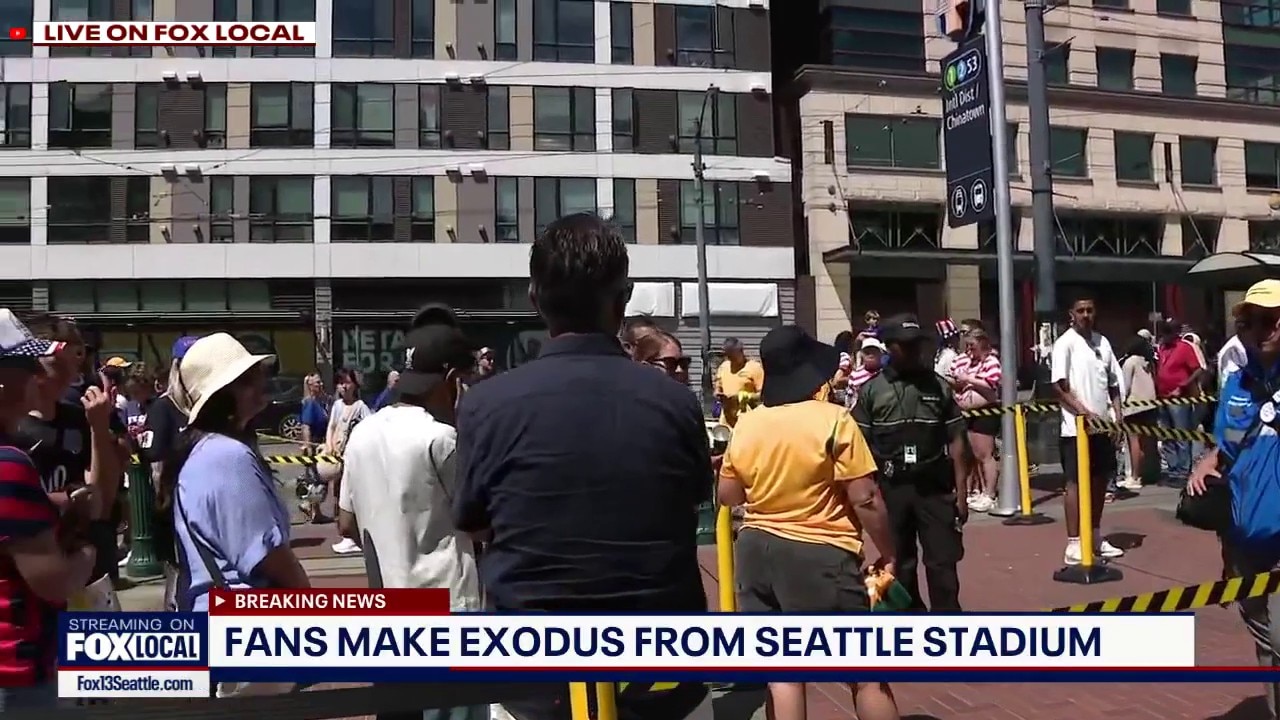 Fans wait to take Seattle light rail after match 