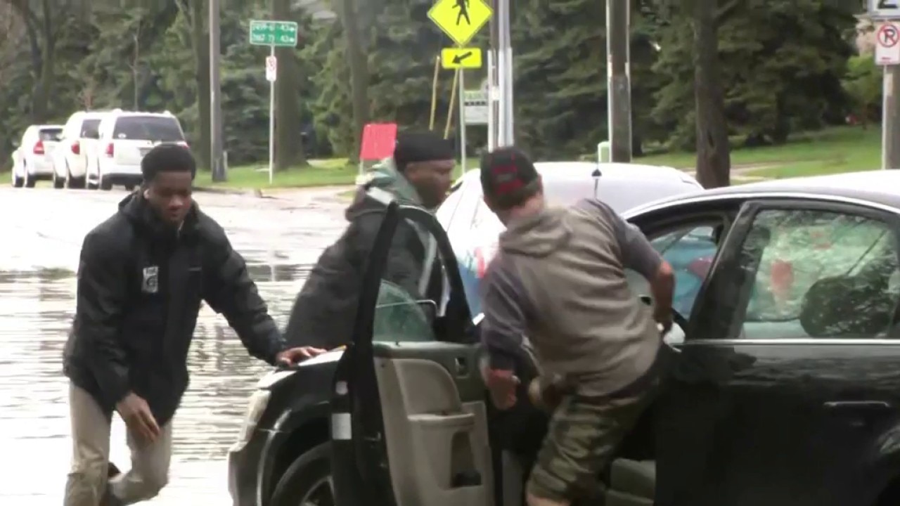 Storms cause flooding in Milwaukee; FOX6 reporter helps push out vehicles stuck in stand water