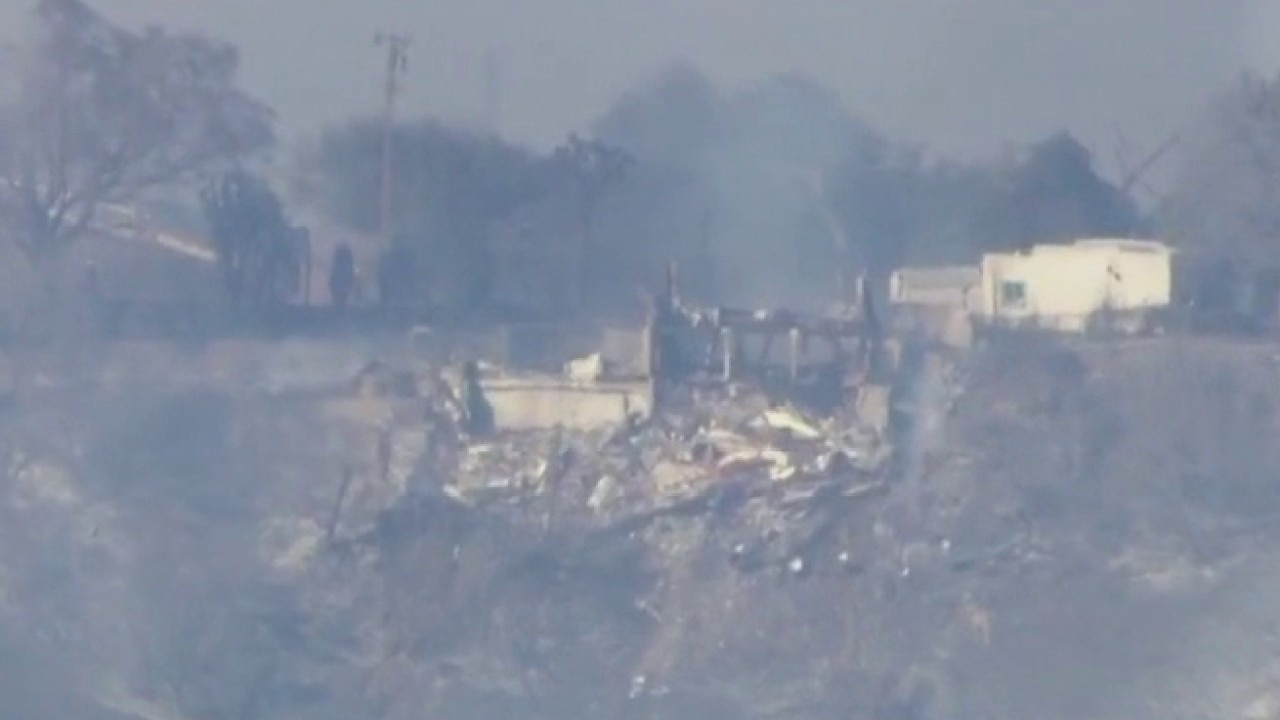 Woman reacts to losing home to Palos Fire