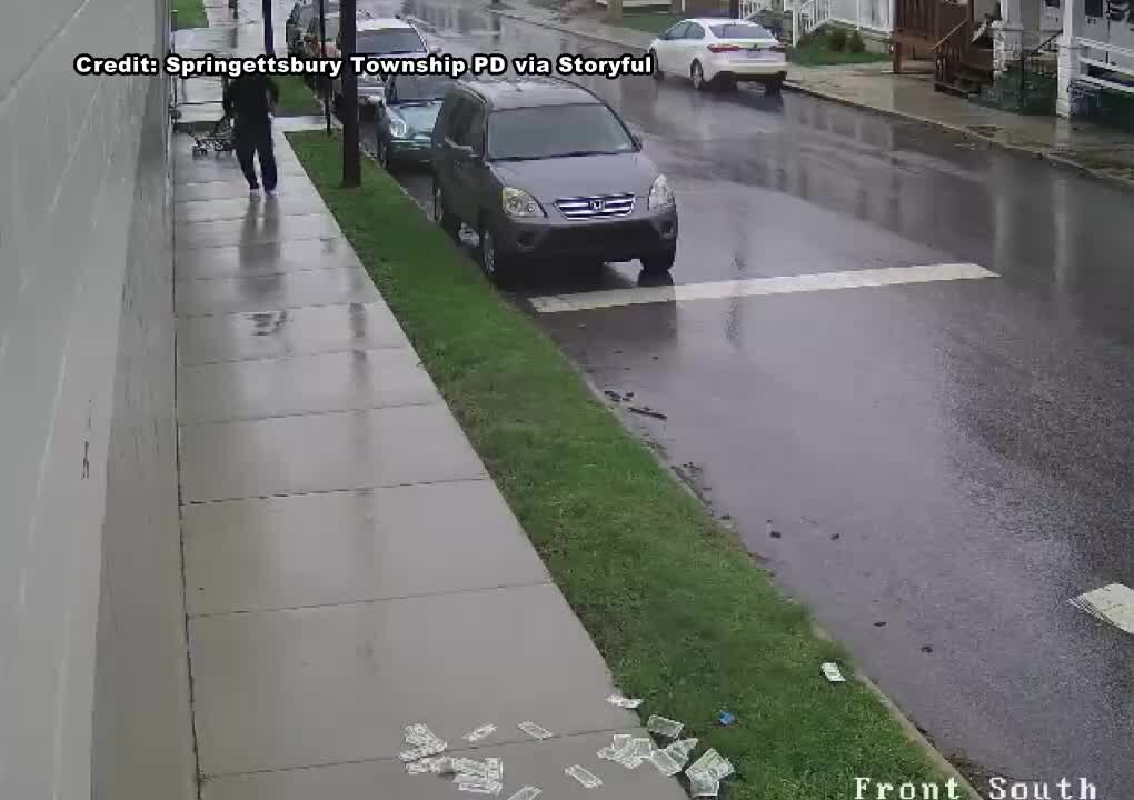 Robbery suspect drops cash