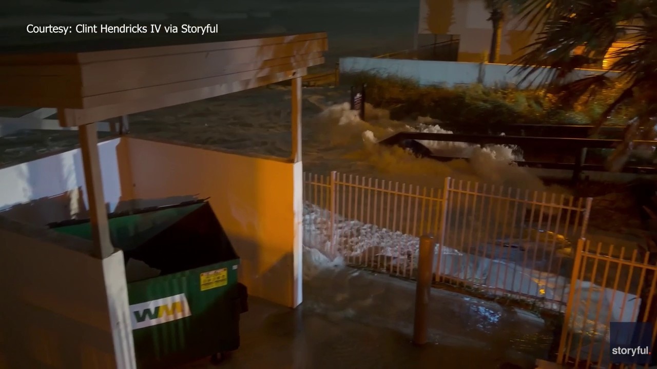 Floodwaters rush into Florida yard during Isaias