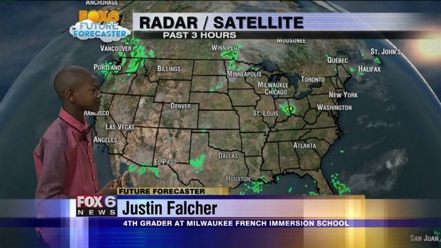 Justin Falcher helps Meteorologist Stephanie Barichello with the weather