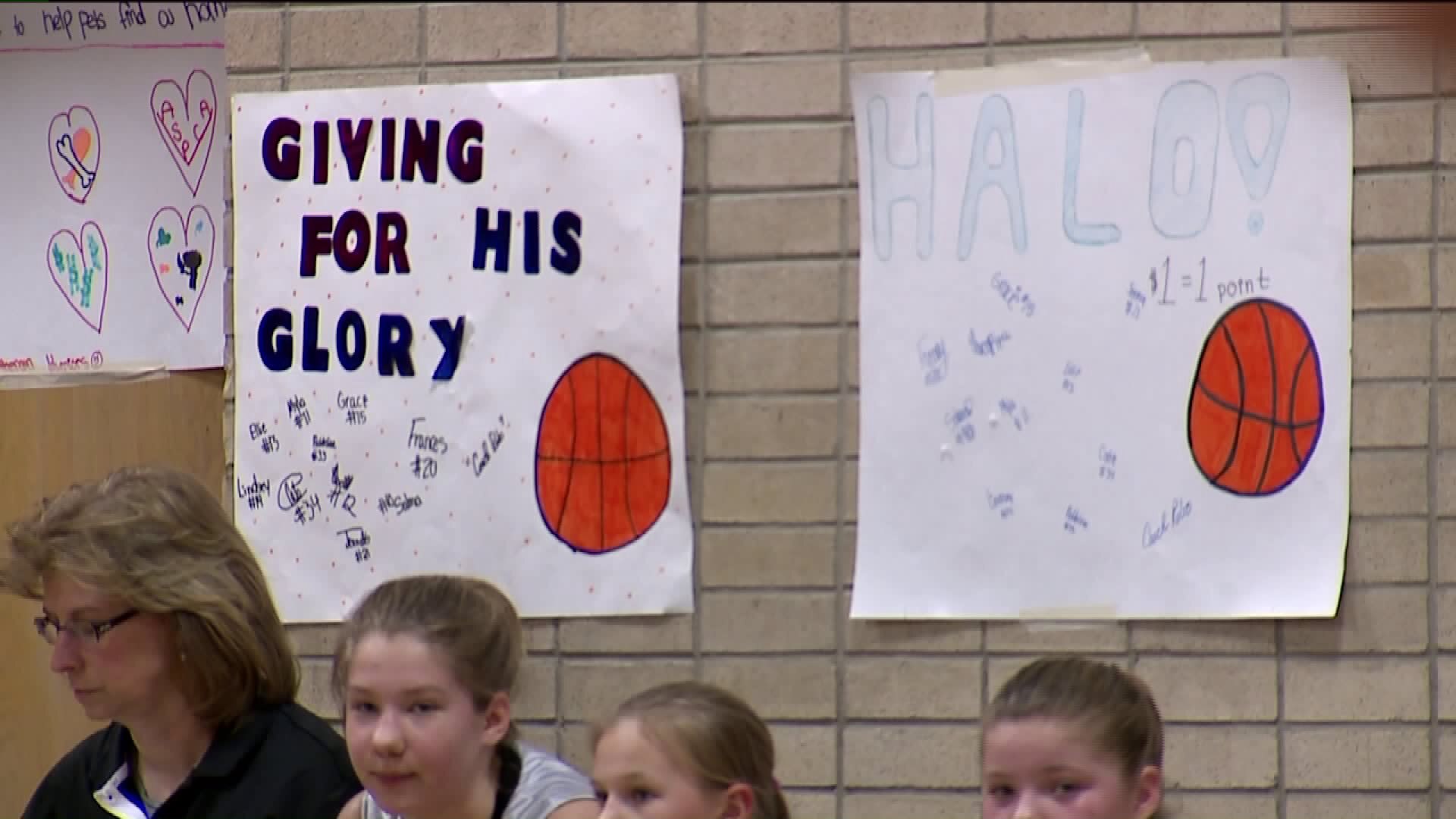 Basketball players at Trinity Lutheran School collect donations for charity